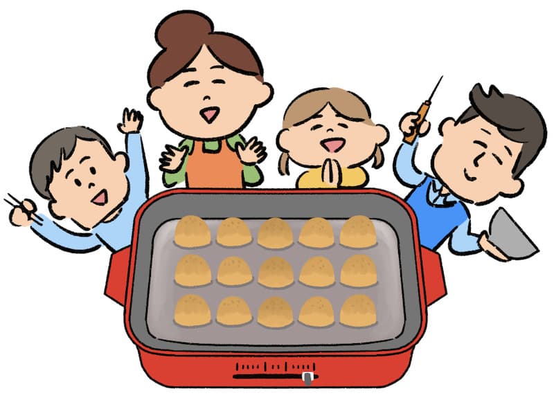 たこ焼きをする家族