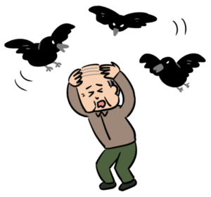 カラスに襲われるおじさん