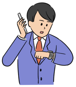 時計を見ながら電話をかける男性